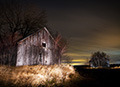 ligthpainting on barn at night in Quebec, Canada